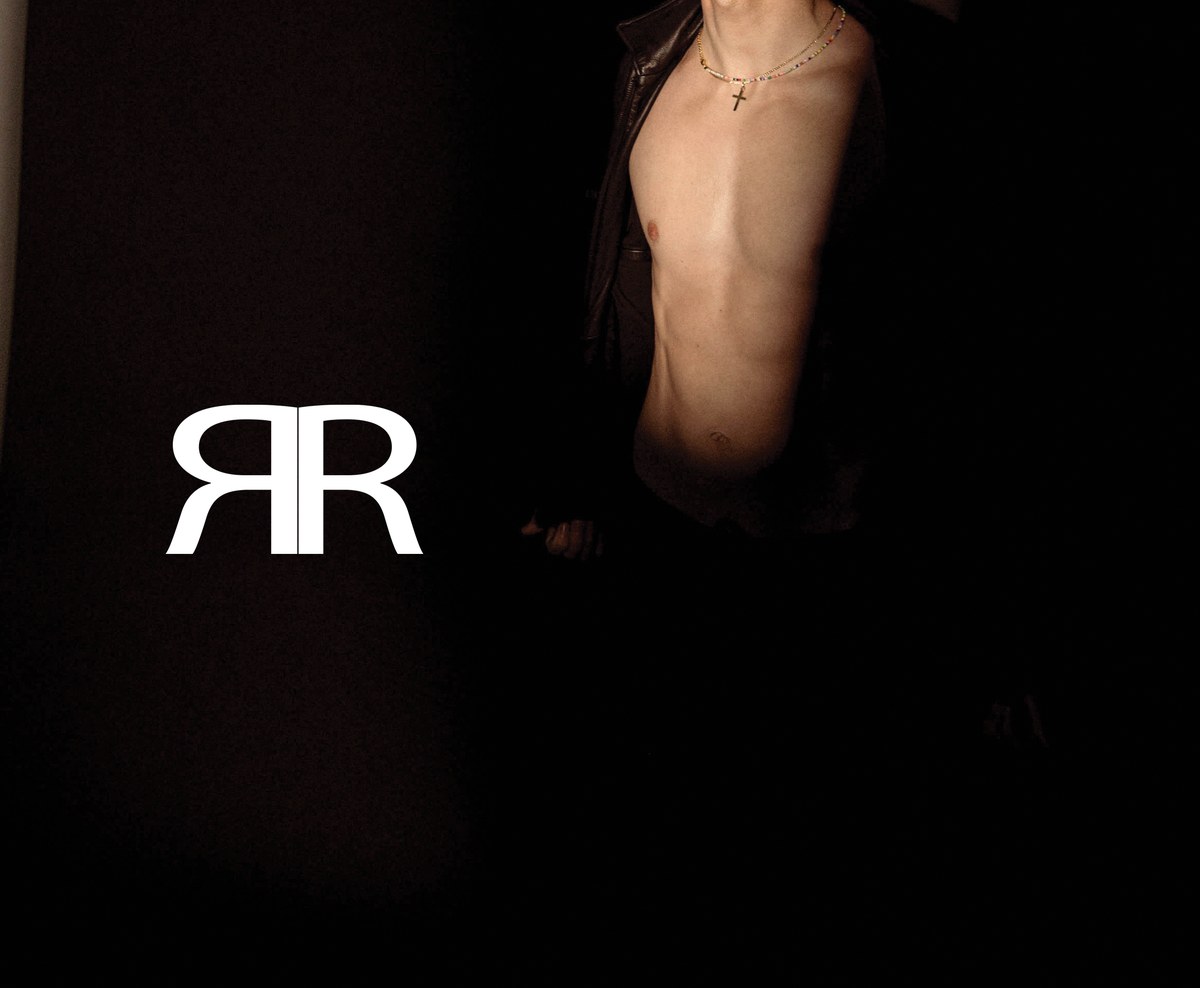 Monogram · leather torso left. Left-chest RR embroidery reference — pearl on obsidian ground.