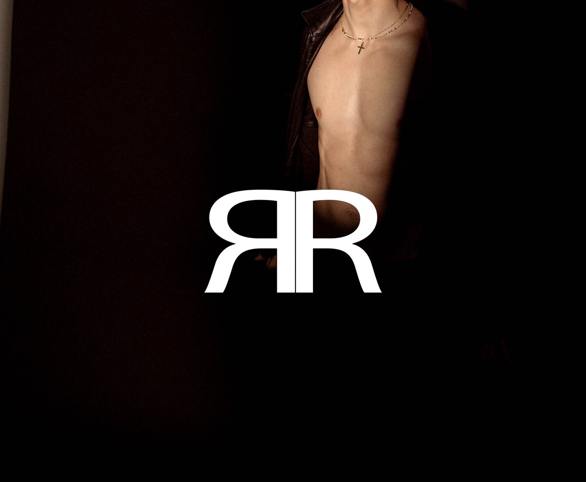 Monogram · leather torso right. Right-chest variant. Production uses left-chest per Code 3 (one dominant idea, one support cue).